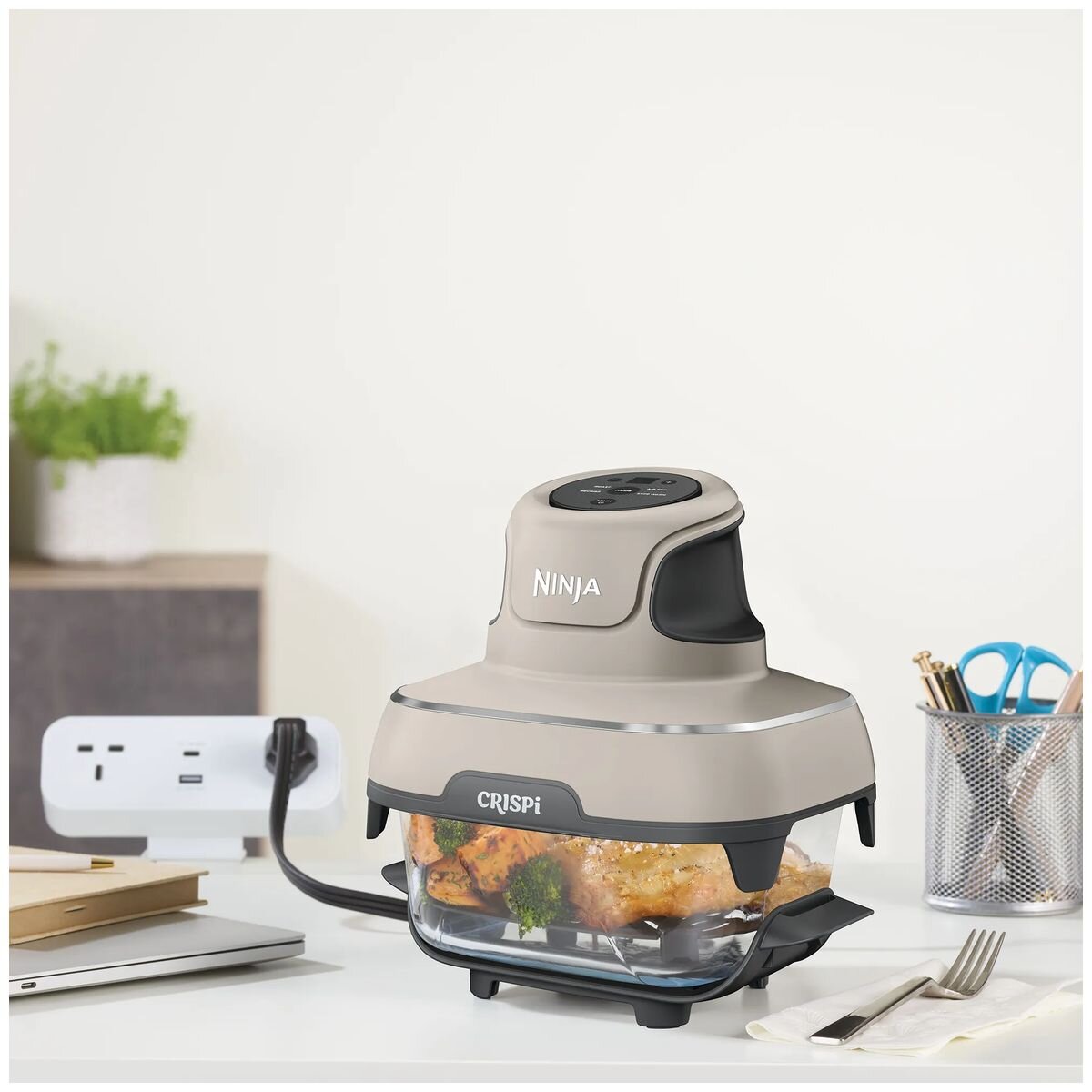 Ninja Crispi portable glass air fryer on countertop