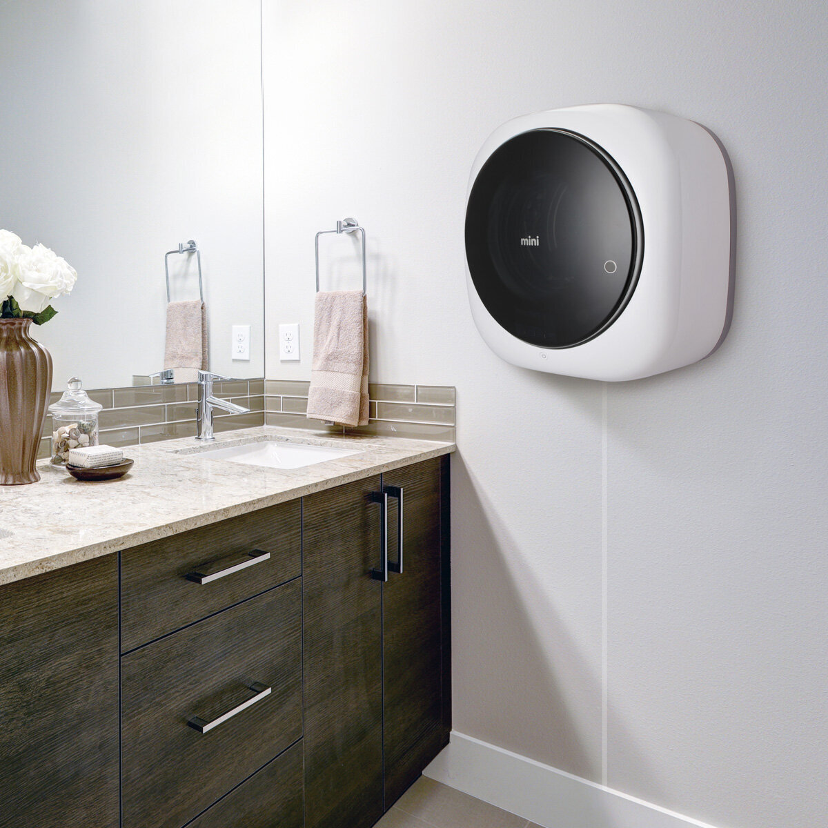 Wall mounted outlet washing machine