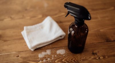 Use a special screen cleaning solution or a homemade version with distilled water and dish soap to clean greasy marks from TV screens.
