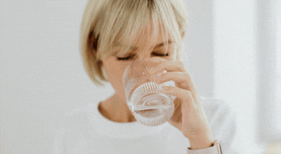 A woman drinks water, and a glass of cold water close-up and a woman using a Zip brand filter tap