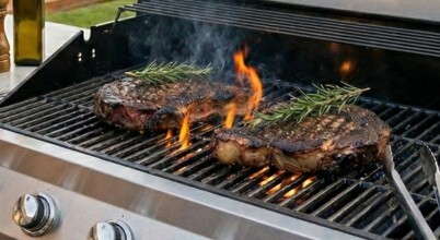 Flame grilled ribeye steak on a BBQ