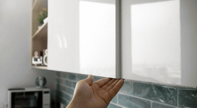 Handle-free cabinetry, high-level storage and lazy Susans maximise space and reduce friction in small kitchens: mix of real and AI imagery