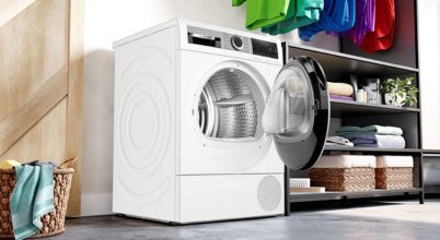 A Bosch series 8 heat pump dryer in a laundry room.