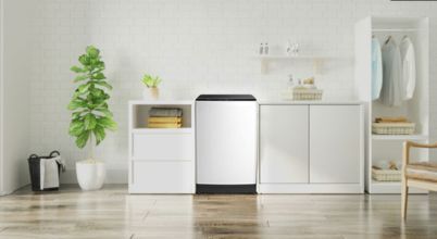 A CHiQ brand top lopad washing machine in a modern laundry