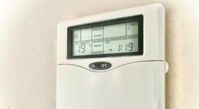 Thermostat showing a temperature set to 19 degrees Celsius, a sweet spot for keeping your home warm enough with high heating costs.
